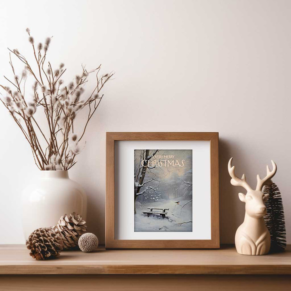 雪に覆われた静寂な森とベンチ、小鳥が寄り添う穏やかなクリスマスシーンのレトロポスター 2枚目の画像