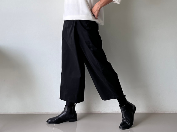 ストレッチスパンデックスコットン　黒　大人気予約販売巻きスカート風なペグトップパンツ 素材   アンクル 1枚目の画像