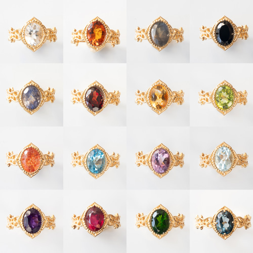 ヴィンテージ風オレンジファセットカットリング18K Modernist 18ct Gold Cluster Ring set with a Sapphire