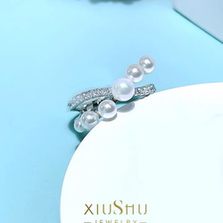 人工マザーオブパール クロス 高炭素ダイヤモンド キラキラ ゴージャス ラグジュアリー白 ホワイト リング 人工真珠 6枚目の画像