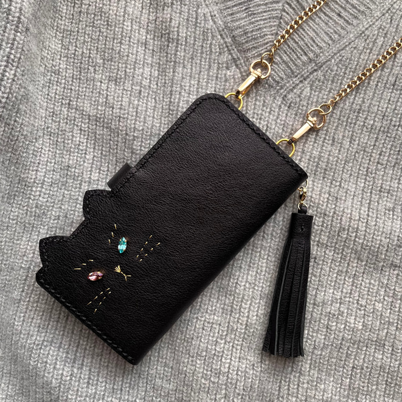 【受注制作】ねこのお顔 Jewelryver. 手帳型スマホケース 縦型ショルダー　黒猫　牛ソフトヌメ革 1枚目の画像