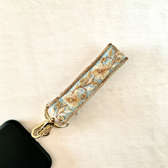 印度刺繡絲帶手帶智慧型手機搭配短帶天藍色金色 第2張的照片