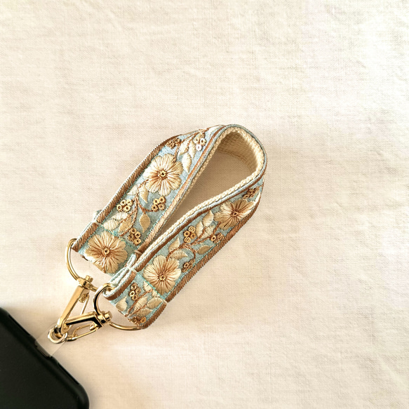 印度刺繡絲帶手帶智慧型手機搭配短帶天藍色金色 第1張的照片