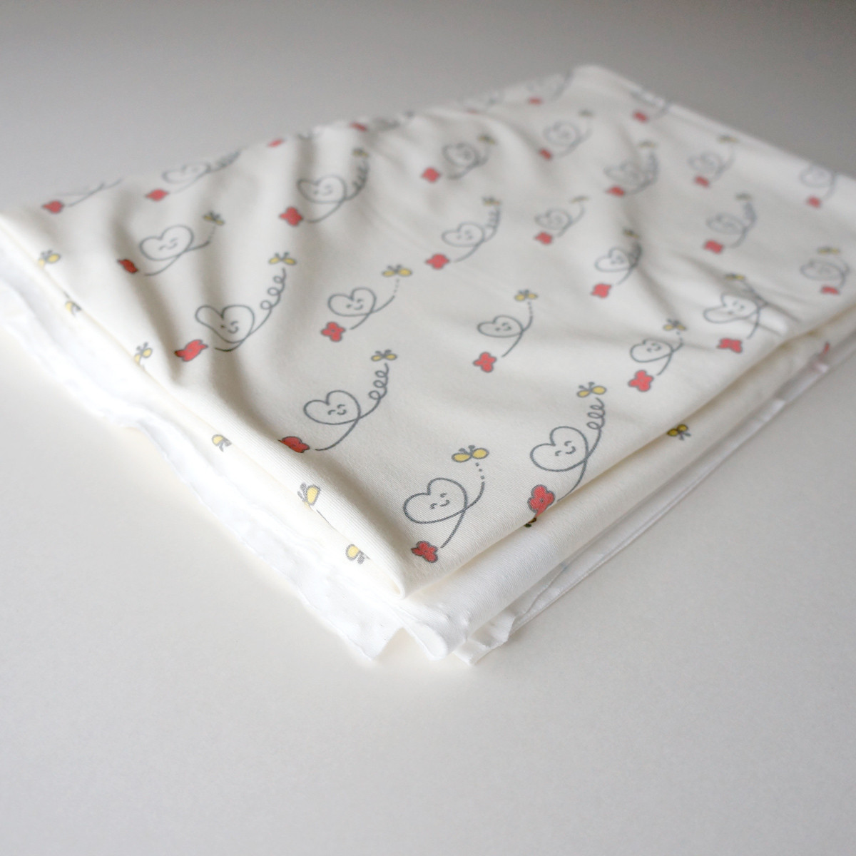 【140×97cm】スムースニット生地(オーガニックコットン)ハートニコちゃん - a little big 【140×97cm】スムースニット生地(オーガニックコットン)ハートニコちゃん - a little big