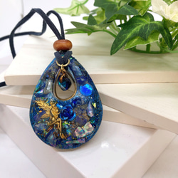 夕焼け空に架かる虹になびく藤の花。雲レジン オルゴナイト 蓄光