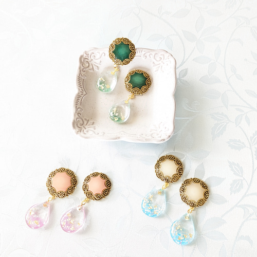 レジン×ビンテージボタンの耳飾り ピアス（その他） ソーインググッズ 