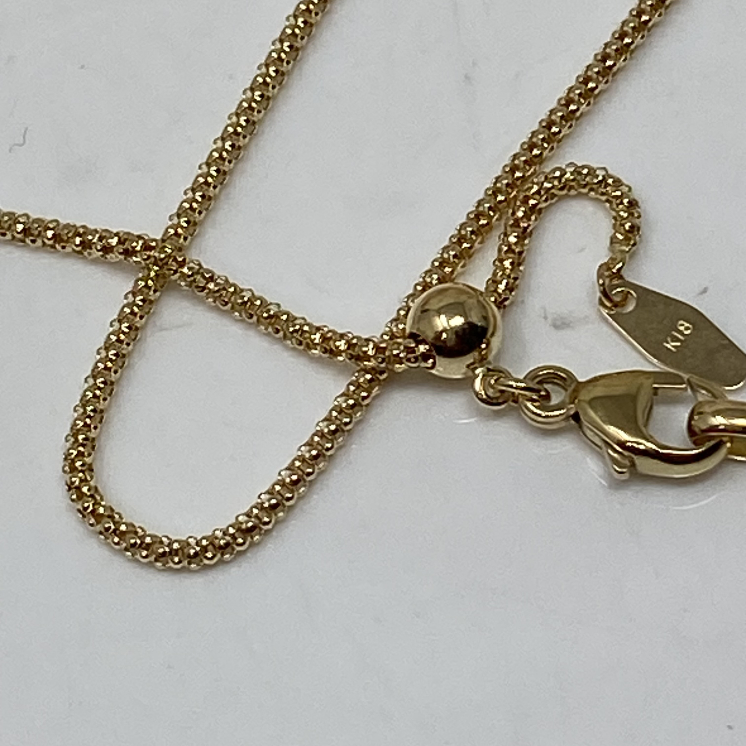 k18YG AU750 18金　イエローゴールド  マルベリー デザイン の幅1.4ミリ