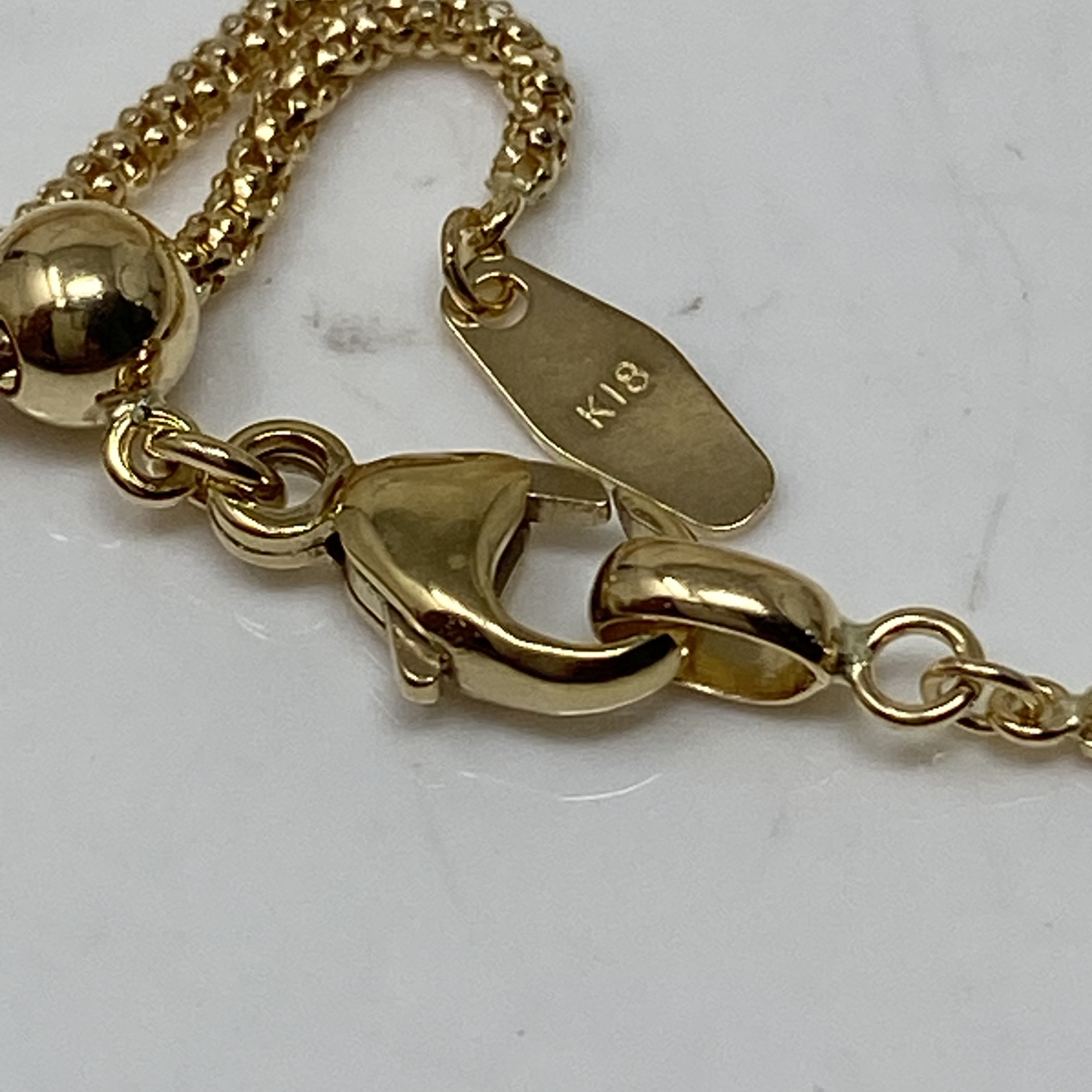 k18YG AU750 18金　イエローゴールド  マルベリー デザイン の幅1.4ミリ