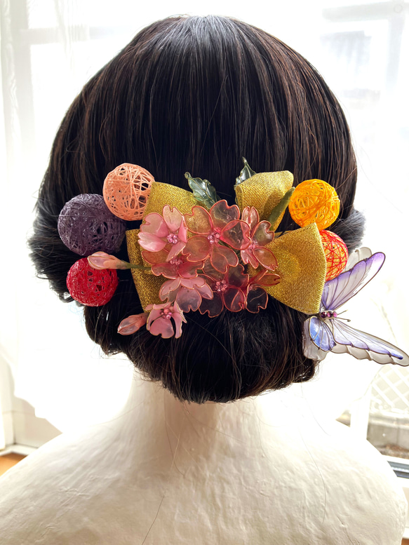 桜と蝶と糸玉の髪飾り 3枚目の画像