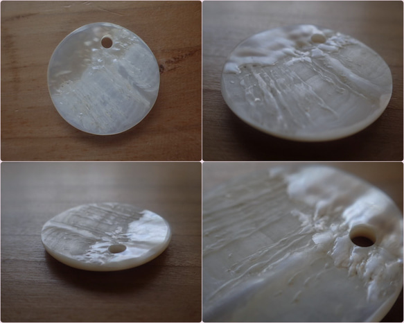 珍珠母貝 = 白色珍珠吊墜頂部，幾乎呈圓形 第10張的照片
