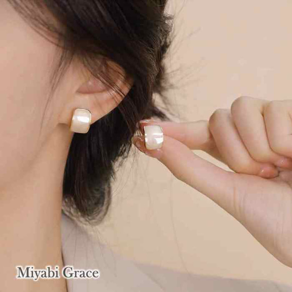 白色耳環流行無痛無孔金色簡約矽膠套簡約白色大理石耳環 第14張的照片