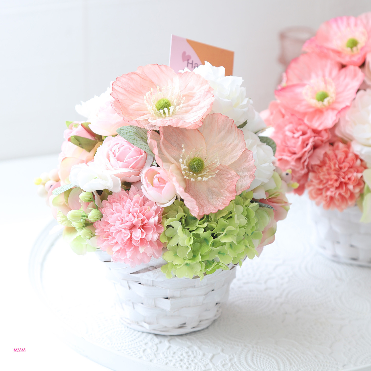 ピーチピンクのバスケットアレンジ 4,839円