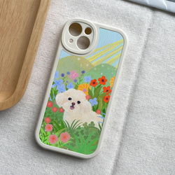 携帯電話保護ケースは、iPhone 15/14/13/12/11/10のすべてのモデルと互換性があります。かわいい花と犬のイラス 1枚目の画像