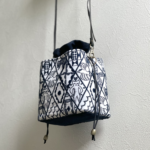 ⚮̈ミナペルホネン symphony white ネリオバッグ あおり巾着バッグ