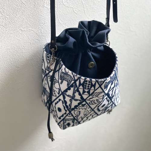 ⚮̈ミナペルホネン symphony white ネリオバッグ あおり巾着バッグ