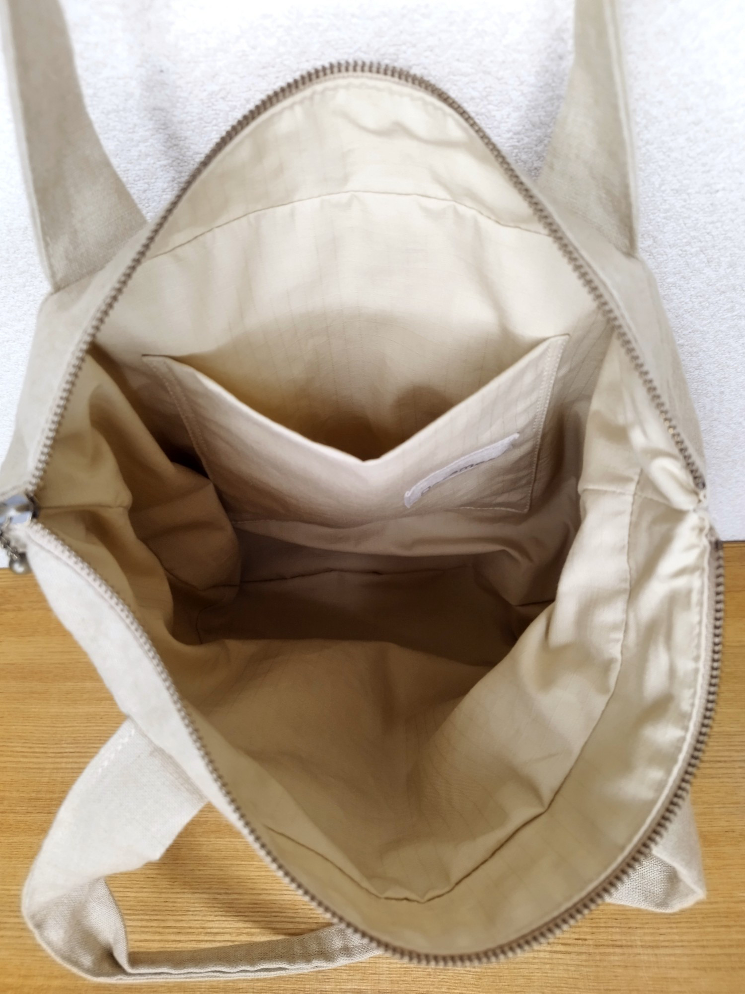 ⚮̈ミナペルホネン symphony white ネリオバッグ あおり巾着バッグ