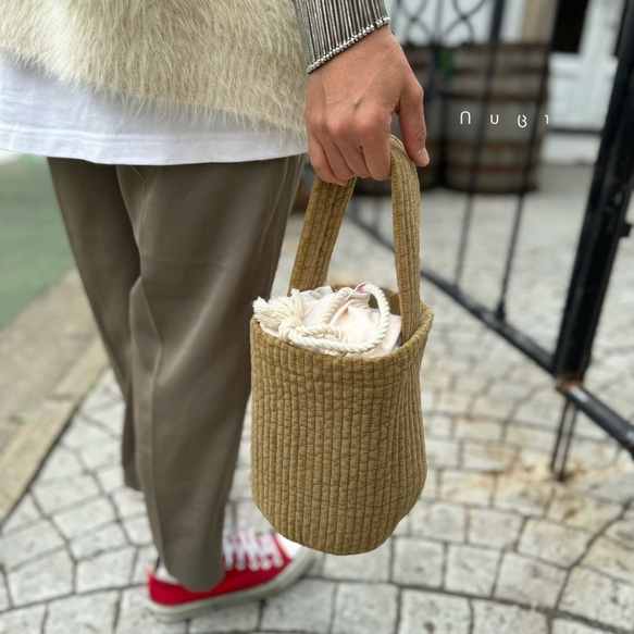 巾着がついた丸底のヌビバッグ まるトートS 巾着バッグ nubi 通販