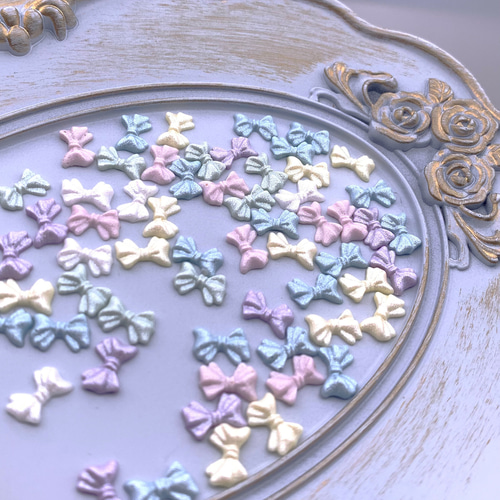 ネイルパーツ リボン 10mm ラメ 混色 100個 3D 艶強め 蝶々結び 樹脂