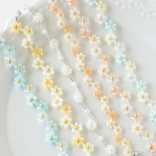 ジグザグフラワーのビーズブレスレット クリアオレンジ