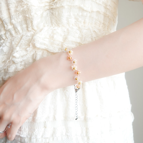 ジグザグフラワーのビーズブレスレット クリアオレンジ ブレスレット