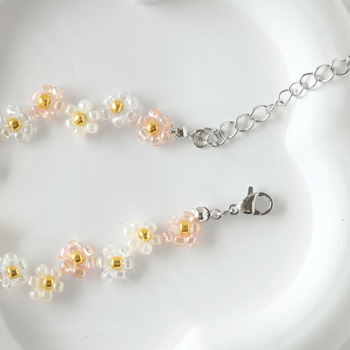 クリスタルオレンジビーズブレスレット ジグザグフラワーのビーズブレスレット クリアオレンジ