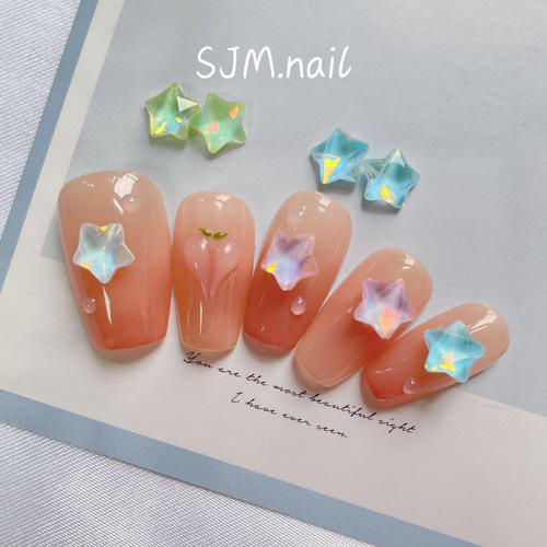 P695(2個)ネイルパーツ 黄色 イエロー 星 スター オパール ストーン