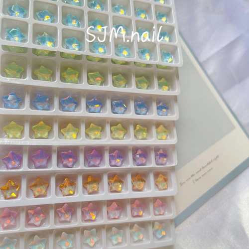 P695(2個)ネイルパーツ 黄色 イエロー 星 スター オパール ストーン