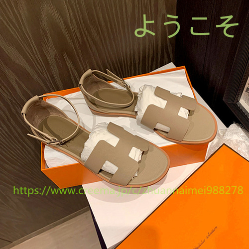 夏の新作1字バックル本革サンダル仙女風中空平底後ローマのビーチ