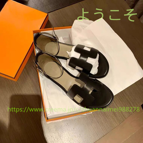 夏の新作1字バックル本革サンダル仙女風中空平底後ローマのビーチ