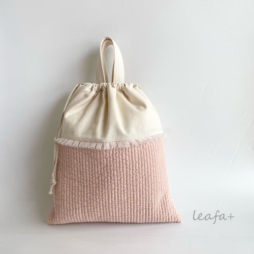 ヌビキルティングの持ち手付き巾着 レース・お名前刺繍付きにも
