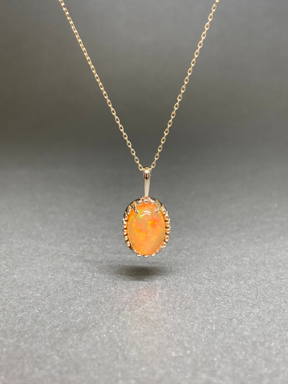 オレンジ色の中に浮かぶ幻想的な遊色が美しいファイアオパールk10YG