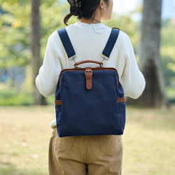 「帆布x皮革組合」框架背包扁平式扣環手工經典背包 第15張的照片