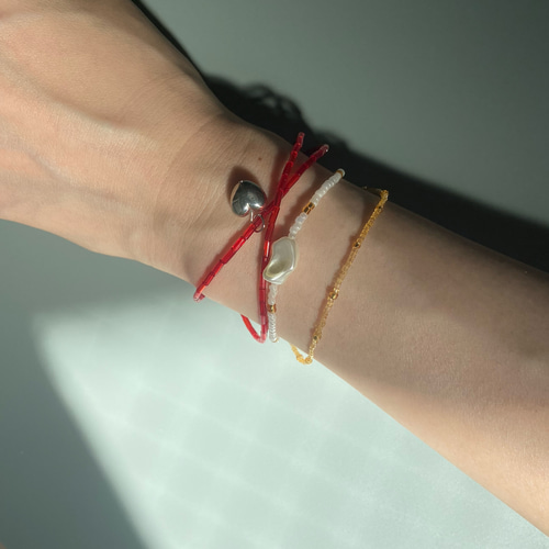 ビーズ ブレスレット 華奢 クリア オレンジ ブレスレット AME 通販