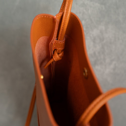 義大利真皮垂直手拿包，防水，輕巧迷你包，單肩包[橘色] 第9張的照片