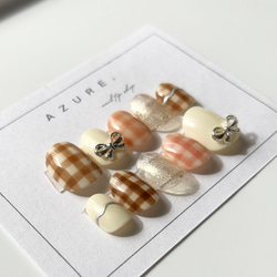 レトロネイルガーリーネイル春ネイルリボンネイルブラウンネイルチェックピンクぷっくりネイルチップ短め長めガーリー振袖春夏 1枚目の画像