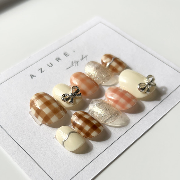 レトロネイルガーリーネイル春ネイルリボンネイルブラウンネイルチェックピンクぷっくりネイルチップ短め長めガーリー振袖春夏 1枚目の画像