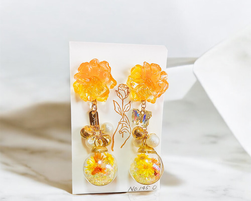 ハンドメイド 青とオレンジの花柄ピアス m92658233781_1.jpg?1699964132