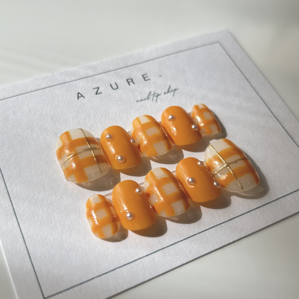 ナチュラルネイルチェック柄ツヤネイルオレンジネイル春ネイルニュアンスネイルミラーネイルオフィスネイルネイルチップ振袖冬春 1枚目の画像