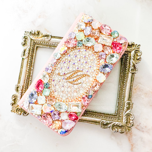 ピンク手帳型iPhone17pro,Max,16,15,14,SE他 スワロフスキーイニシャル