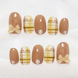 チェックとリボンのガーリーネイル/イエローベース/リボン/チェック/ネイルチップ 1枚目の画像