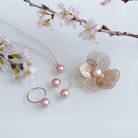 我們最受歡迎的商品：稀有的櫻花粉淡水珍珠項鍊和耳環套裝。非常適合生日或母親節的禮物。 第14張的照片