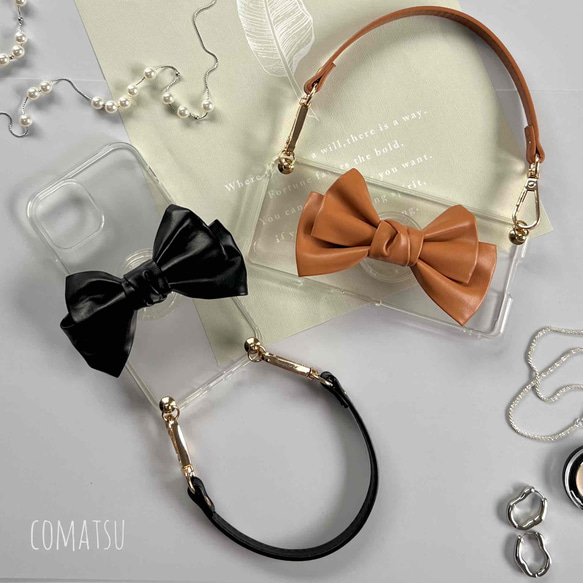 【全機種対応】大ぶりPUレザーりぼん スマホケース グリップソケット+ハンドストラップ付き スマホカバー 1枚目の画像