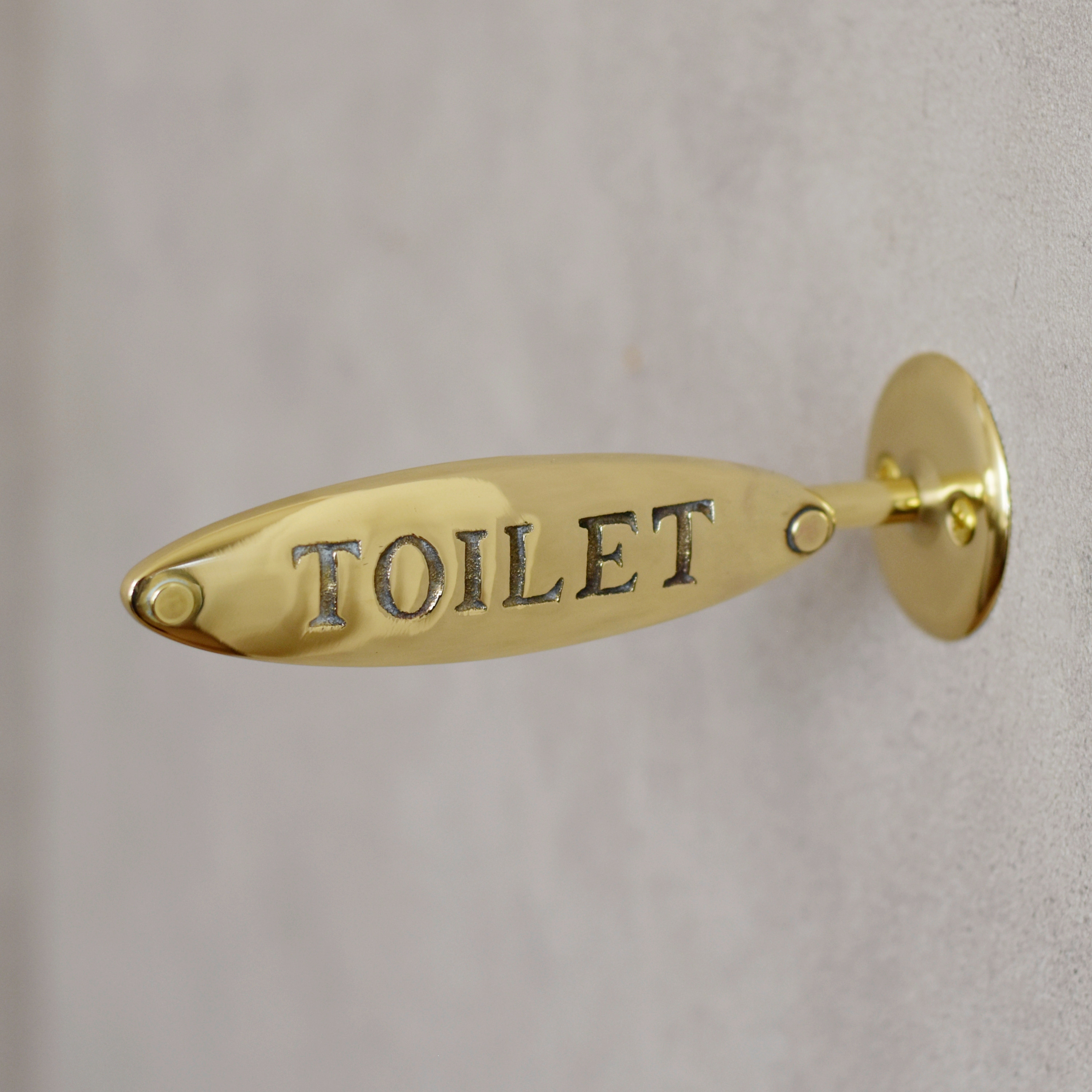 真鍮の突出しサイン　トイレ