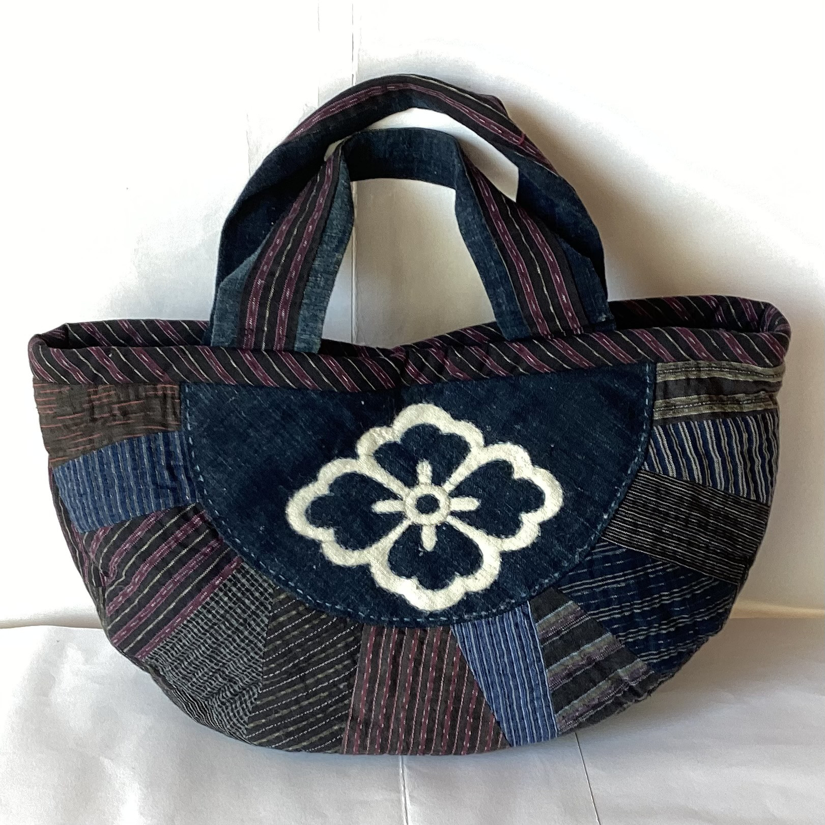 紋入り布と縞布の半円のバック