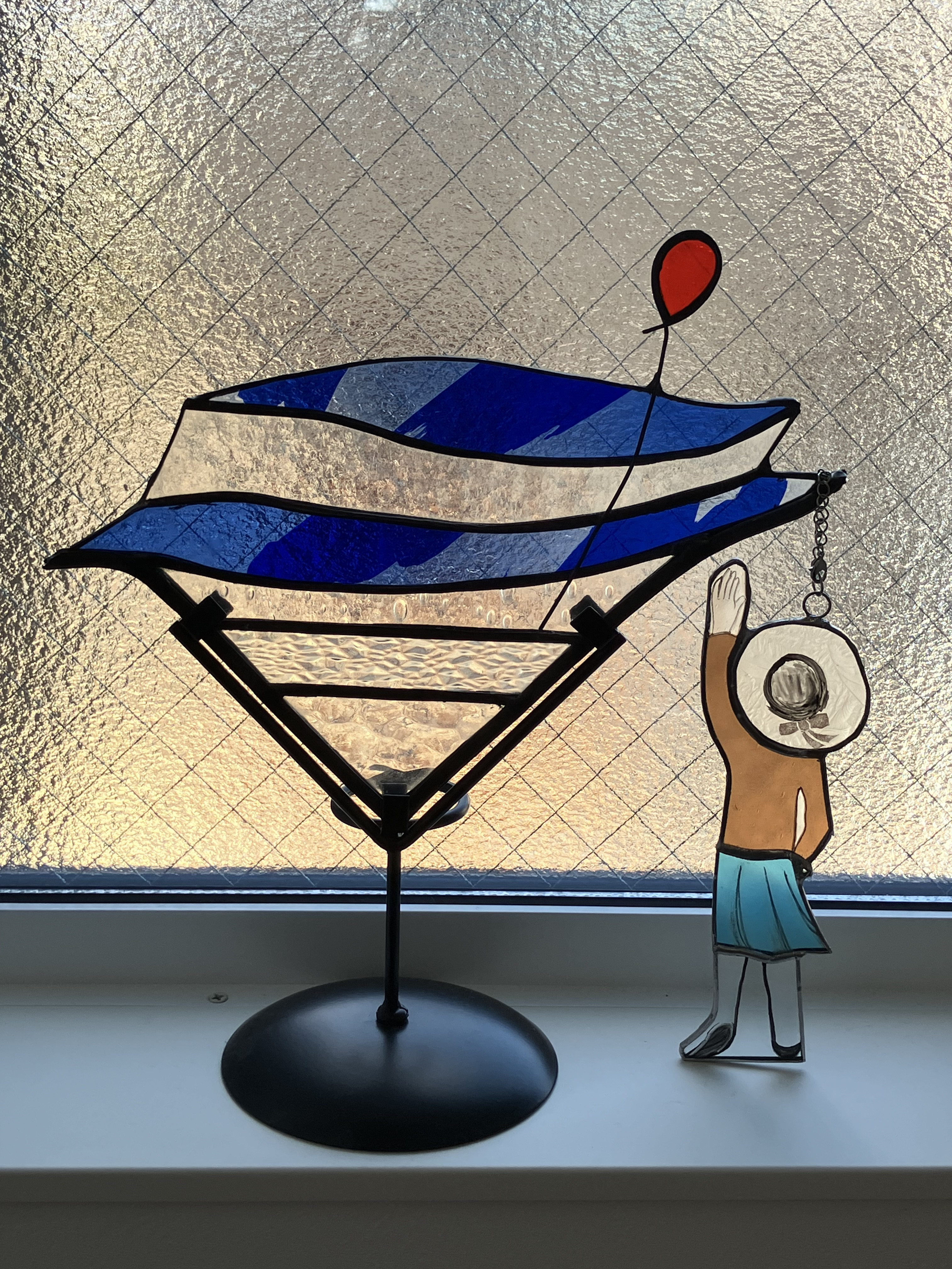 海と少女と赤い風船