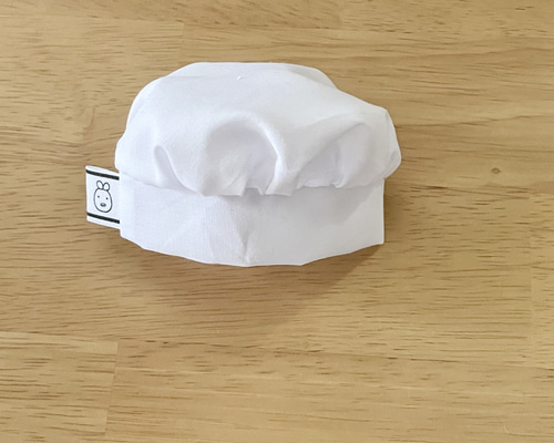 シェフの帽子をかぶった白いぬいぐるみ Amazon.co.jp: Bontand かぶりもん 着ぐるみ 餃子 ぬいぐるみ帽子