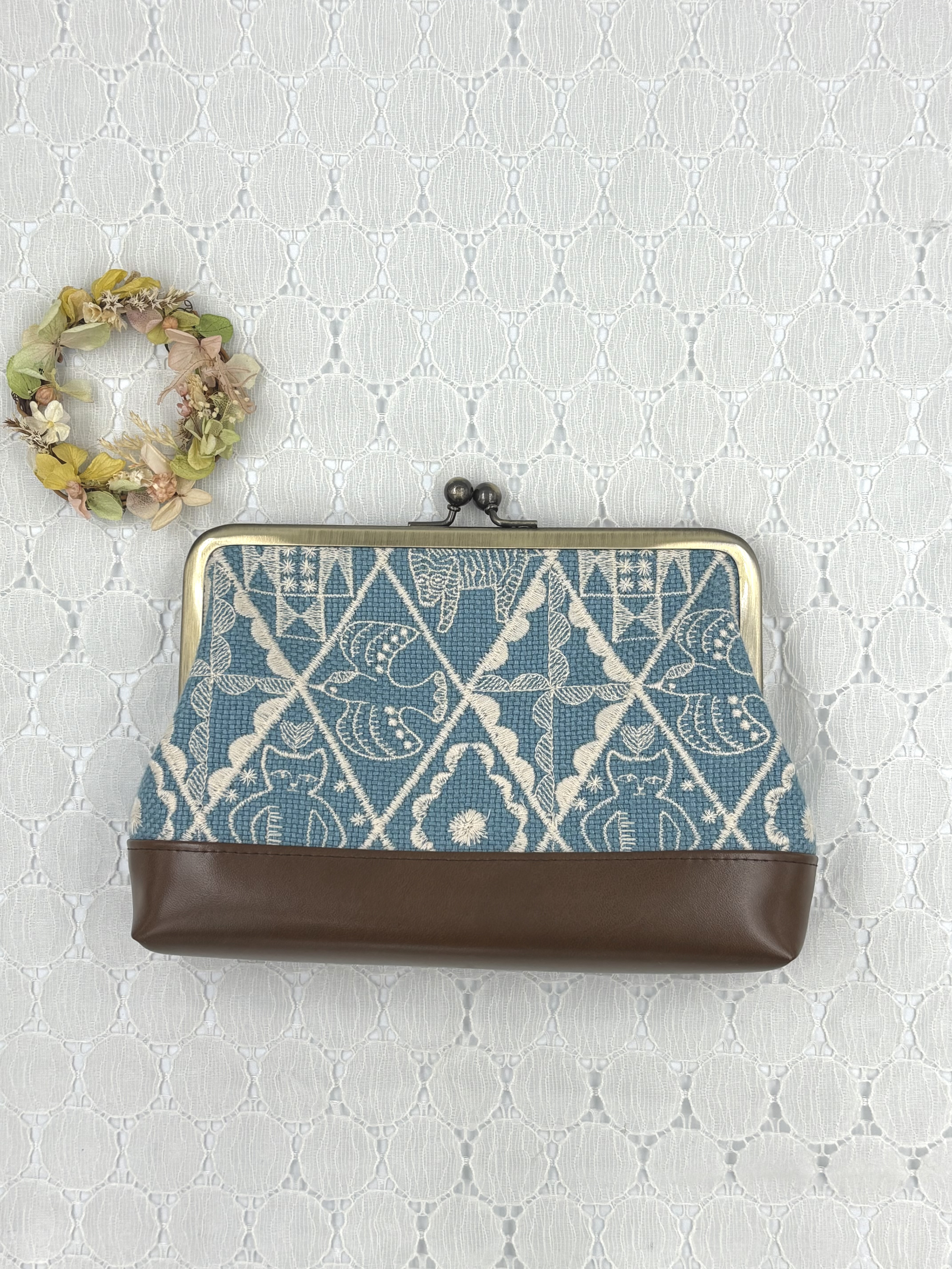 ミナペルホネンの生地で作ったがま口ポーチ