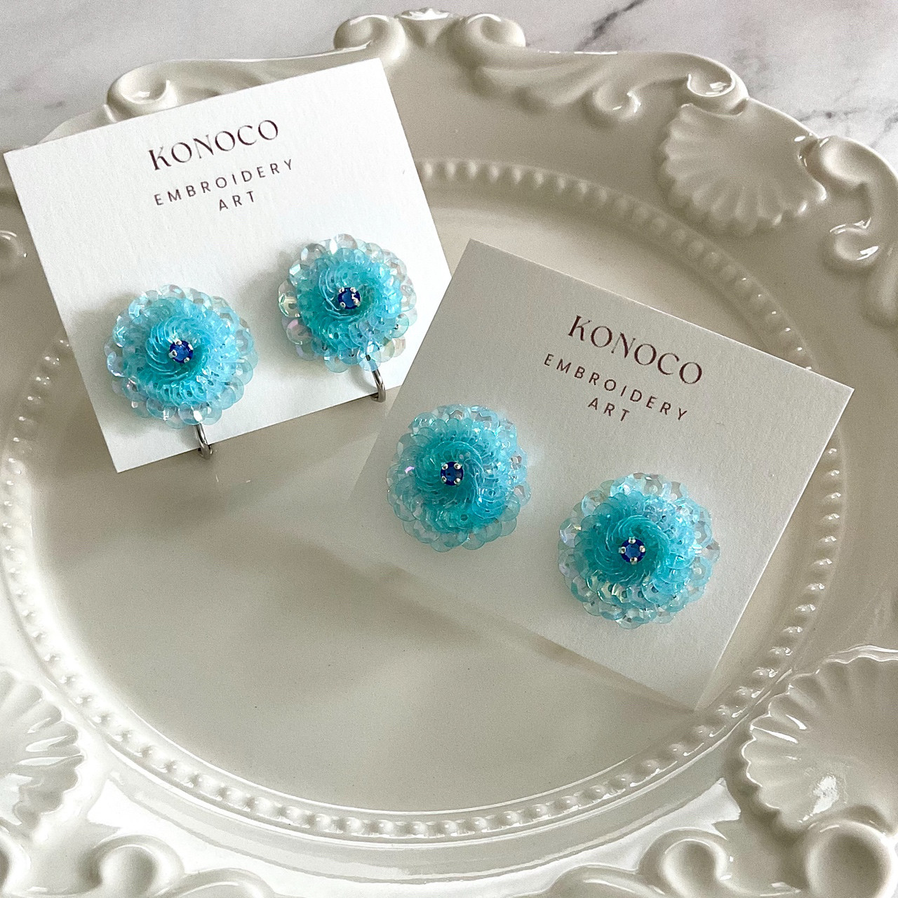 ラナンキュラスの耳飾り(オーロラライトスカイブルー×アクアマリン)