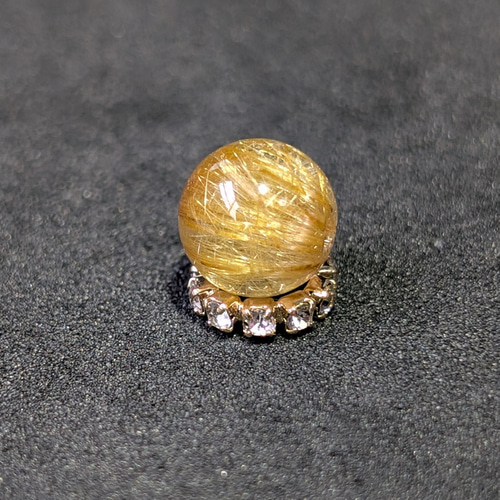 ギラギラ輝くキャッツアイルチル クォーツ 8ミリ 1粒売り 金銭運を呼ぶ