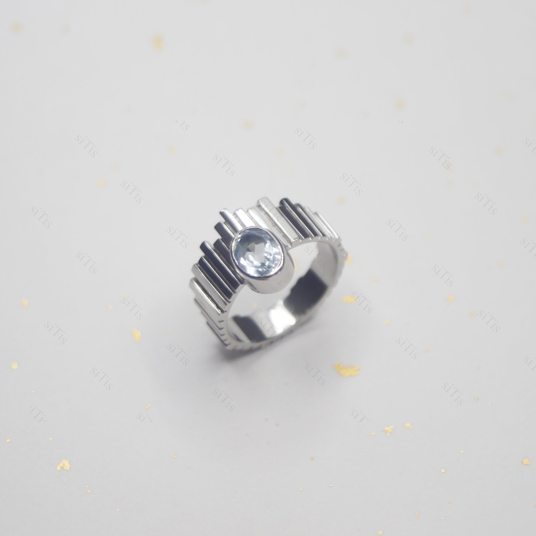 ハンドメイドのシルバーリング  Skalisto Half トパーズ